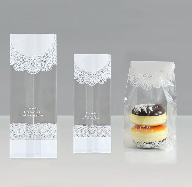 Transparente Kunststoff-Geschenktaschen mit weißer Spitze für Cookies und Snacks zur Dekoration von Hochzeiten, Geburtstagen oder Babypartys - Bild 1