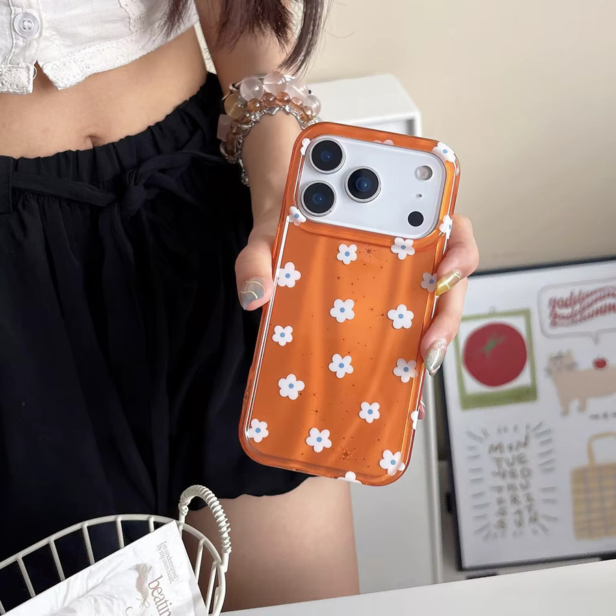 Stoßfeste Handyhülle für iPhone 17, 16, 15 und 14 Pro Max mit glänzendem orangefarbenem Hintergrund und weißen Blumenmustern - Bild 5
