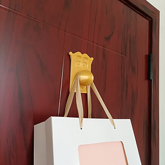 Lustiger Cartoon-Gesichtshaken in Gold aus Kunststoff zur Wandmontage für Kleidung und Taschen - Bild 1