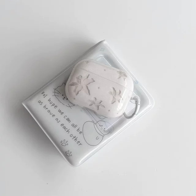 Transparente Kopfhörer-Schutzhülle mit Lilienblumen-Stern-Design und Anhänger für Apple AirPods 1 2 3 4 Pro Pro 2 Pro 3 in Weiß - Bild 1