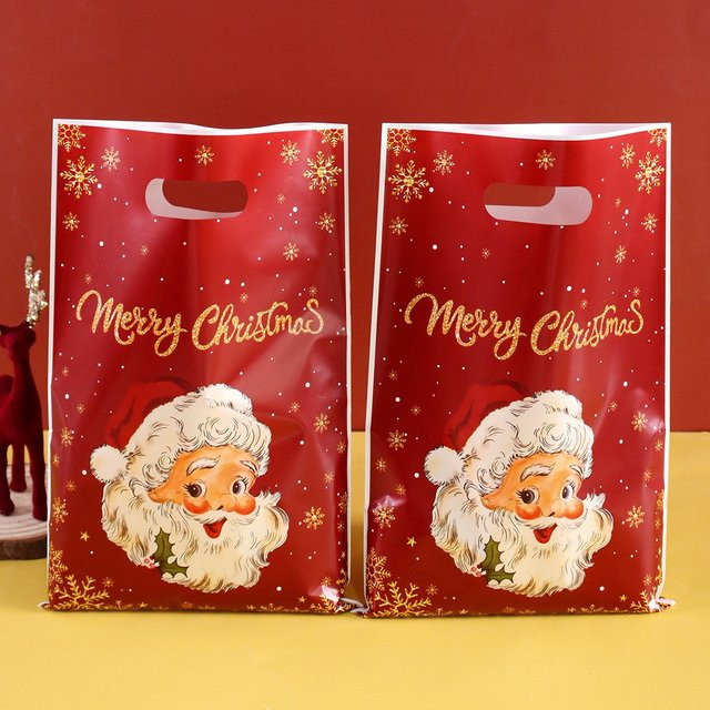 Rote Weihnachtsgeschenktüten mit Weihnachtsmann-Motiv für deine Weihnachtsdekoration und Partygeschenke aus Kunststoff - Bild 1
