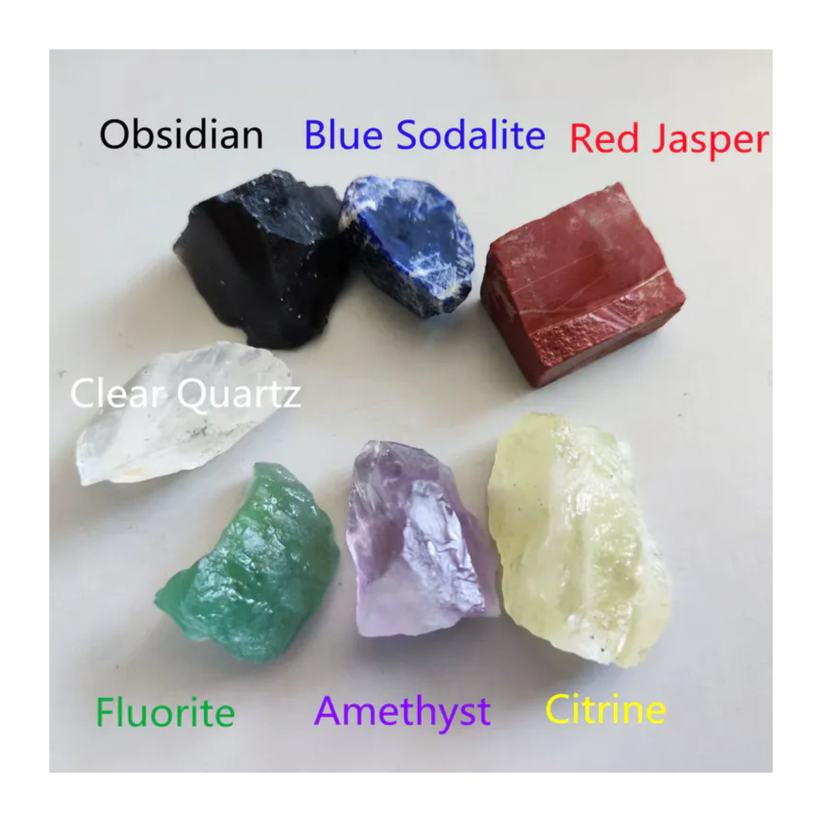 7-teiliges Set aus natürlichen Chakra-Kristallen in unregelmäßiger Form, mehrfarbig mit Citrin, Amethyst, Bergkristall, rotem Jaspis, Obsidian, Fluorit und Sodalith - Bild 2