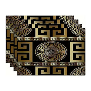 Elegante geometrische Tischsets in Schwarz und Gold für ein luxuriöses Ambiente