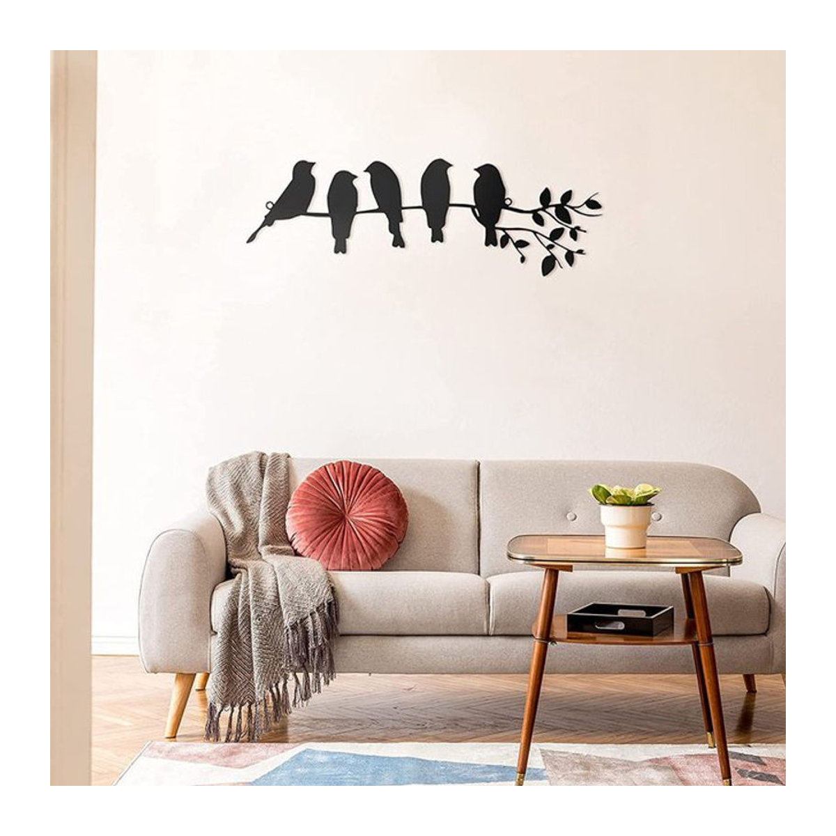 Minimalistische Wanddekoration aus Metall mit Vogel-Silhouetten und Blättern in Schwarz - Bild 1