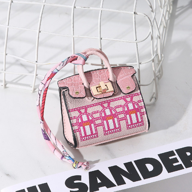 H-home Mini-Tasche als Hängedekoration in Rot und Pink, Modisches Hängeornament aus Textil für Kopfhörer oder Autoschlüssel - Bild 1