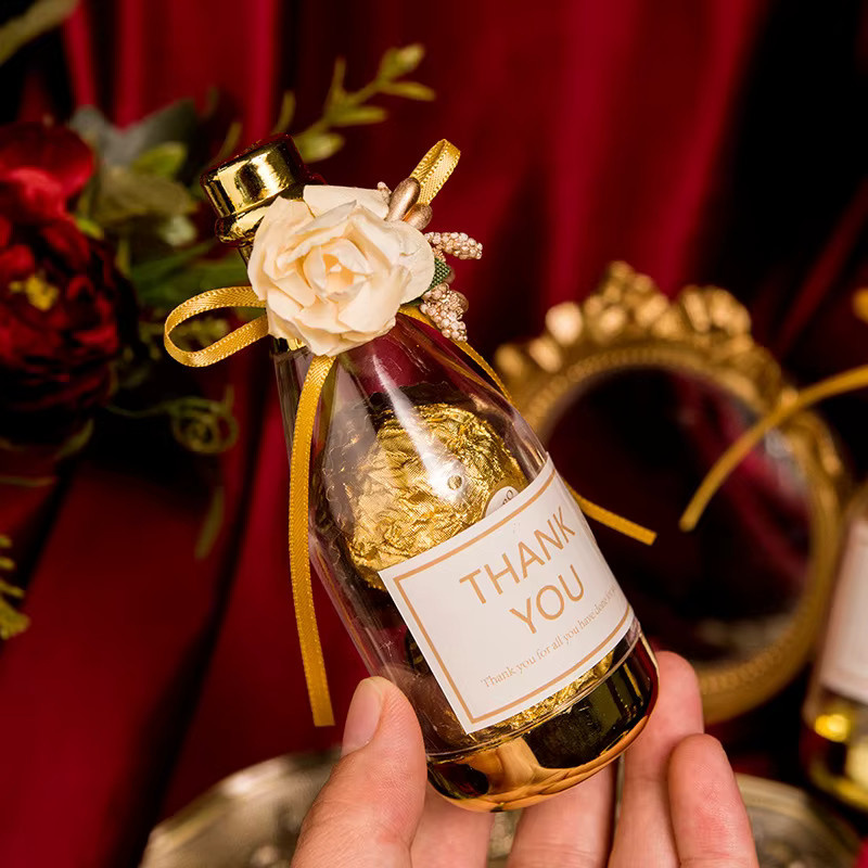 Transparente Pralinenschachtel in Champagnerflaschen-Form mit Gold-Optik aus Kunststoff für Hochzeit, Weihnachten und Geburtstage - Bild 2