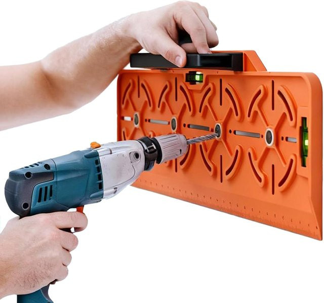 Bohrschablone mit Wasserwaage und Lineal zur Montage von Steckdosen in Orange - Bild 1