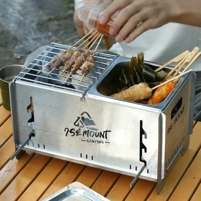Tragbarer Outdoor-Holzofen aus Edelstahl in Silber mit abnehmbarem Grill als Campingkocher - Bild 1