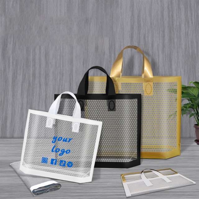 50 Stück transparente PVC-Plastiktaschen mit Wabennetz-Design für Boutiquen und Hochzeiten - Bild 1