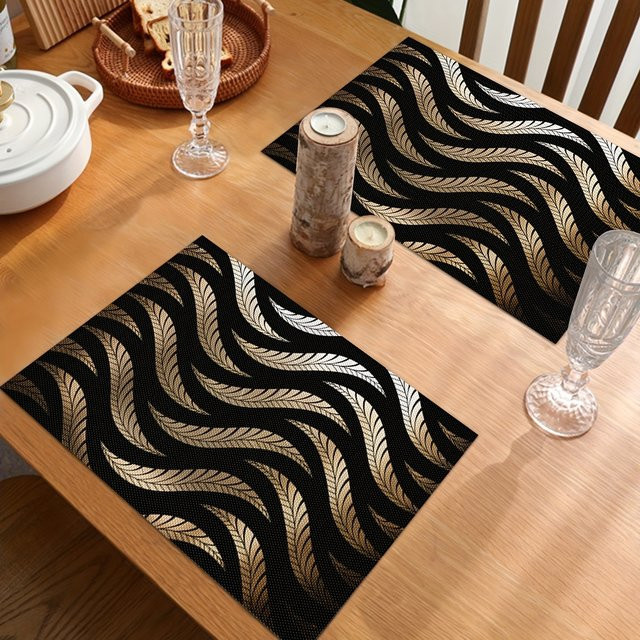 VIKAMA 4-teiliges Set luxuriöse Tischsets aus Leinen mit schwarzem und goldenem Feder-Design in Rechteckform - Bild 1