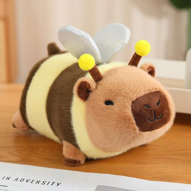 Bliboli Capybara Plüschtier, Liegende Biene Blume Brot Löwe, 25cm - Bild 1