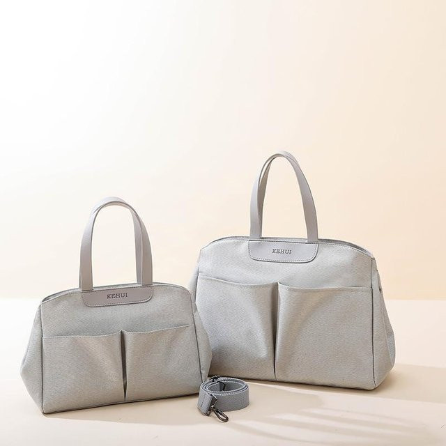 Multifunktionale isolierte Wickeltasche als Crossbody-Schultertasche in Grau - Bild 1