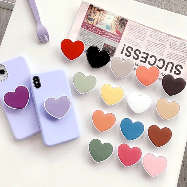 JXSFLYE Herzförmiger Telefonsockelhalter als Fingergriff und Standhalterung für iPhone und Samsung in Weiß und Multicolour - Bild 1
