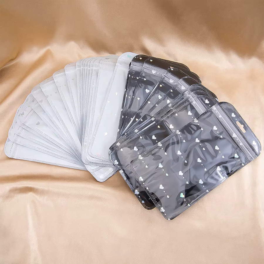 50 Stück MOONMADE Laser-Verpackungsbeutel mit Herz-Design in Schwarz aus Kunststoff für DIY-Partygeschenke und Schmuckverpackungen - Bild 1