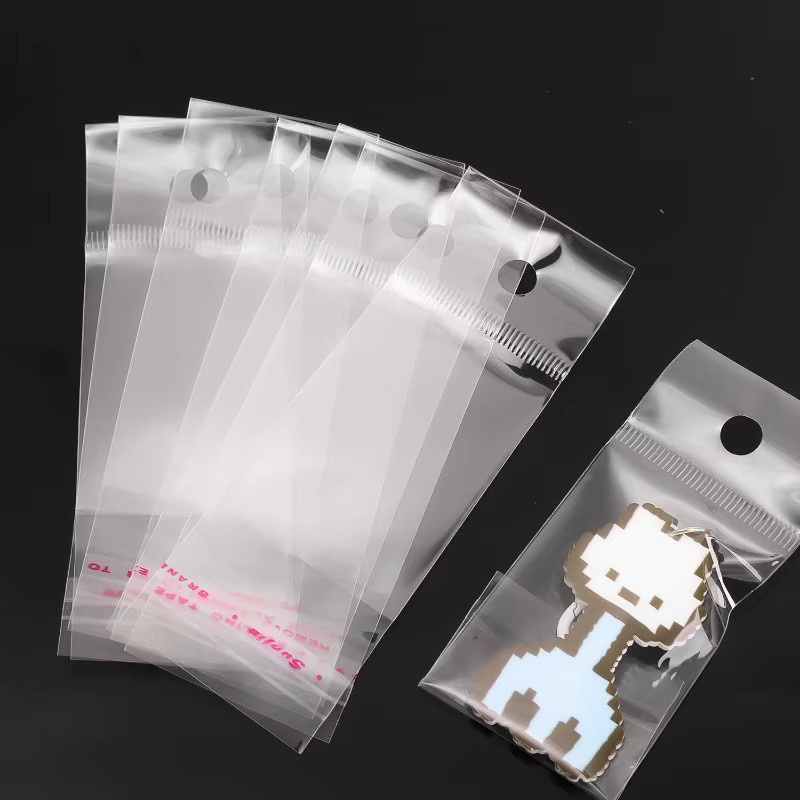 100 Stück transparente selbstklebende OPP Plastikbeutel mit Euro-Lochung für Schmuck und Handwerk - Bild 3