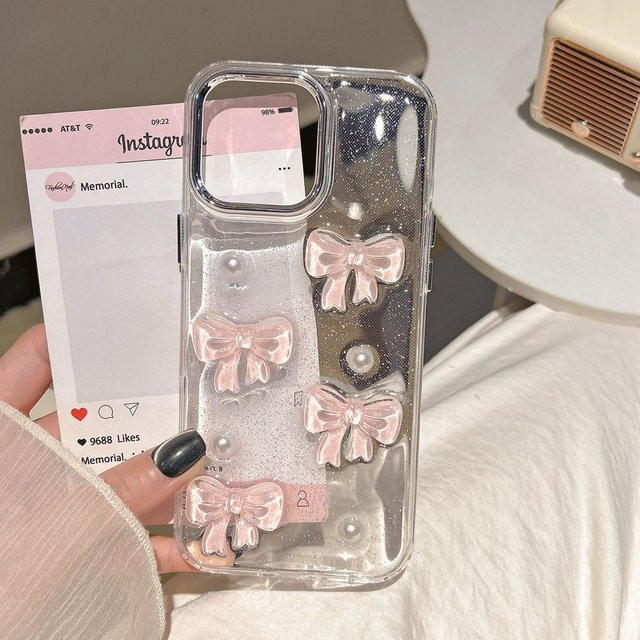 Transparente NUOCDE Handyhülle mit rosa 3D Schleife und Perlen für iPhone 11 bis iPhone 16 Pro Max, stoßfest und süßes Design - Bild 1