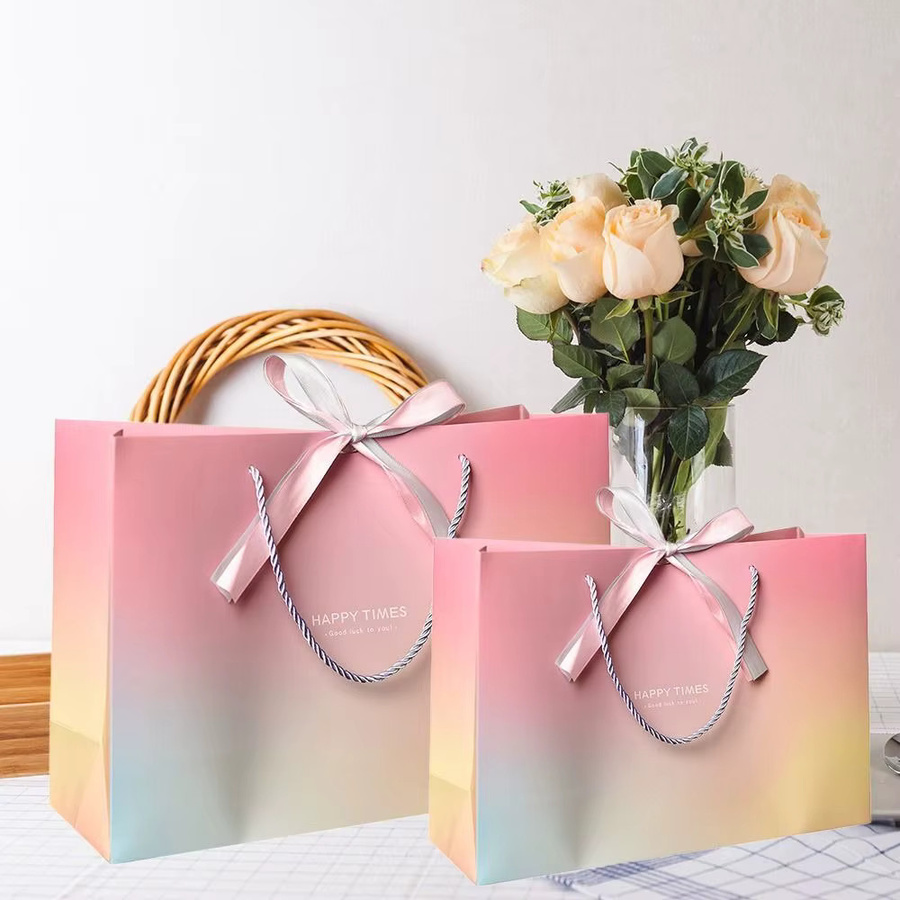 Bunte Papier-Geschenktüten mit Griffen und Schleifenband für Geburtstage und Hochzeiten - Bild 5