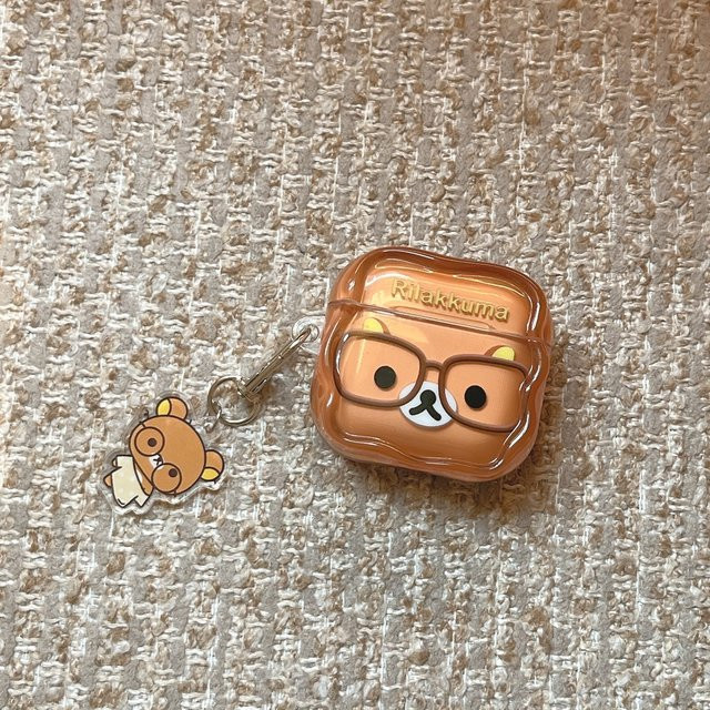 Potdemiel Rilakkuma Bär Kopfhörerhülle für AirPods 4 Pro 3 2 1 in Braun mit Schlüsselanhänger - Bild 1