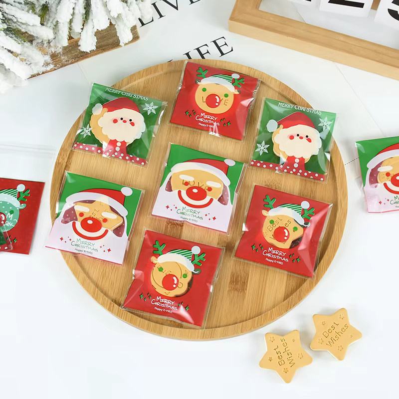 CHIXINHAPPY 50 Stück Weihnachts Süßigkeiten Taschen Transparent mit Santa Claus, Schneemann und Elch Motiven in Rot und Grün - Bild 2