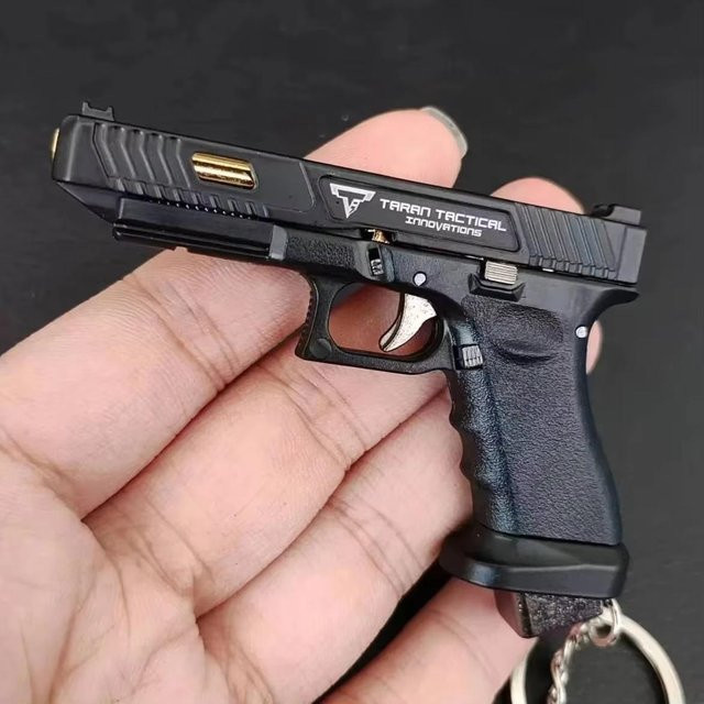 Topmix Schlüsselanhänger Mini-Waffen-Spielzeug, Halblegierung, Unisex - Bild 1