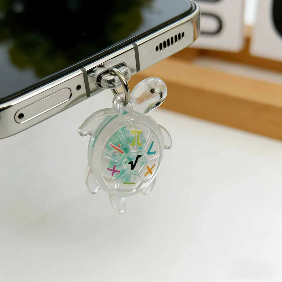 Dekorativer Handy-Staubschutzstopfen mit Schildkröten-Motiv in Transparent für iPhone und USB-C - Bild 2