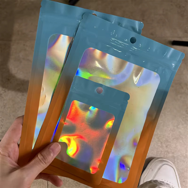 Holografische Reißverschlusstaschen aus Kunststoff für Schmuck, Süßigkeiten und Snacks in Multicolour, Green und Orange - Bild 2