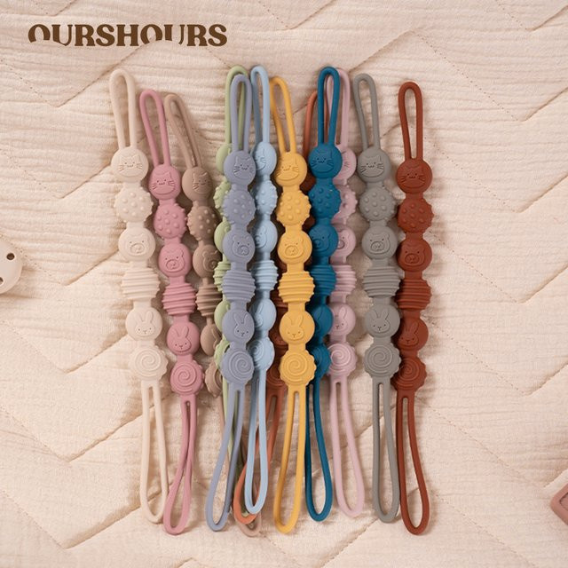 Silikon Baby Schnuller Kette mit niedlichem Tier Design in Orange und Multicolour als Anti-Verlust Lanyard und Zahnen-Spielzeug für Neugeborene - Bild 1