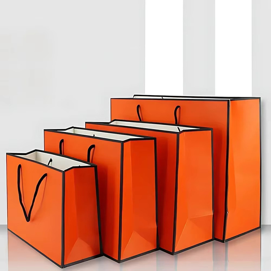 Orangefarbene Papptüten aus Papier für Geschenke und Einkäufe - Bild 2