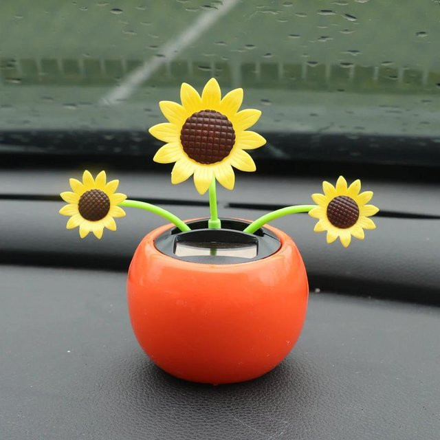 Solarbetriebenes Auto-Ornament von Rui Di mit tanzendem Kopf in Form einer gelben Cartoon-Sonne und Blumentopf als süßes Autozubehör - Bild 1