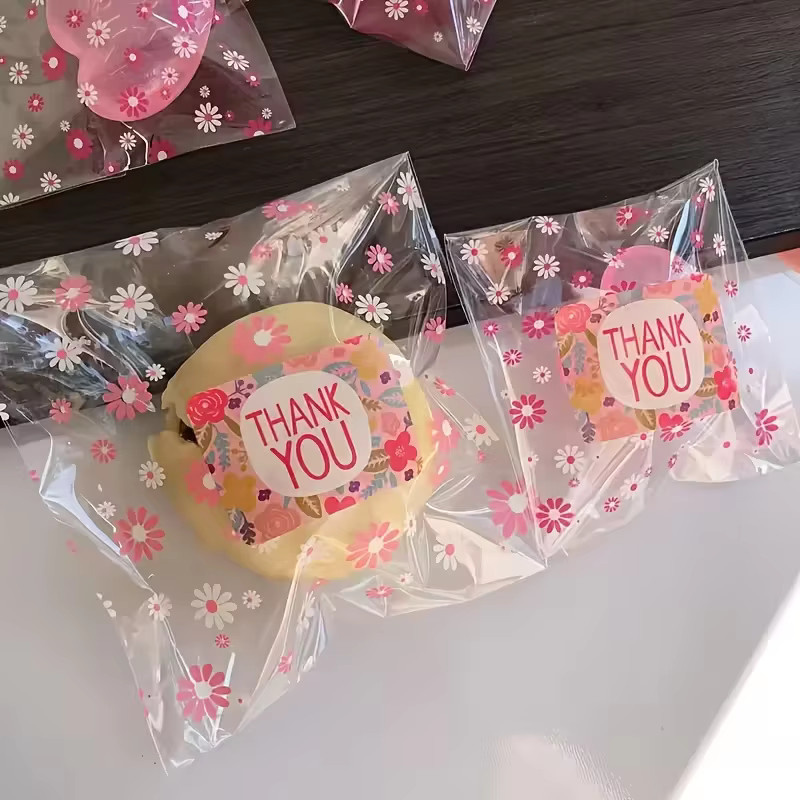 100 Stück transparente Blumen-Verpackungsbeutel in Rosa, selbstklebende Kunststoffbeutel für Süßigkeiten, Kekse und Lebensmittel - Bild 3