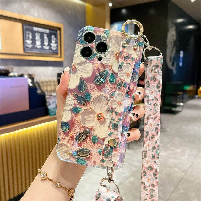 MUQGEW Stoßfeste iPhone Handyhülle mit Blumen-Ölgemälde-Design und Crossbody Lanyard Handgelenk Strap in Multicolour - Bild 1