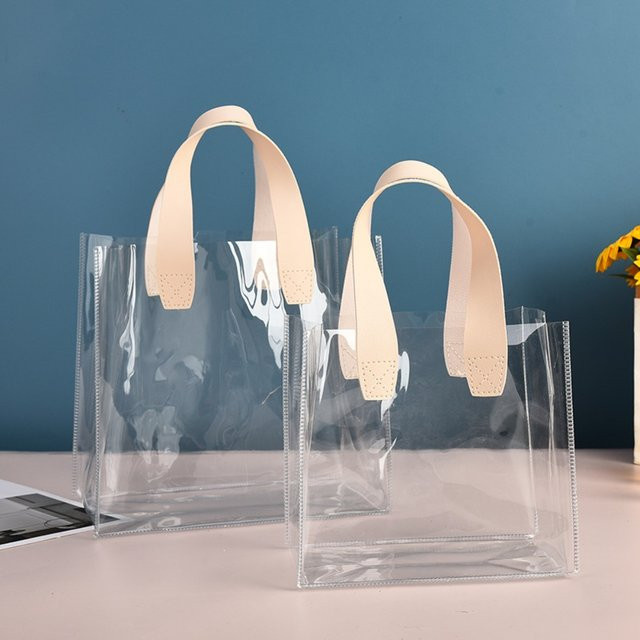 Transparente wiederverwendbare Einkaufstasche aus PVC als wasserdichte Schultertasche für Kosmetik und Geschenke, Farbe: Transparent/Rot - Bild 1