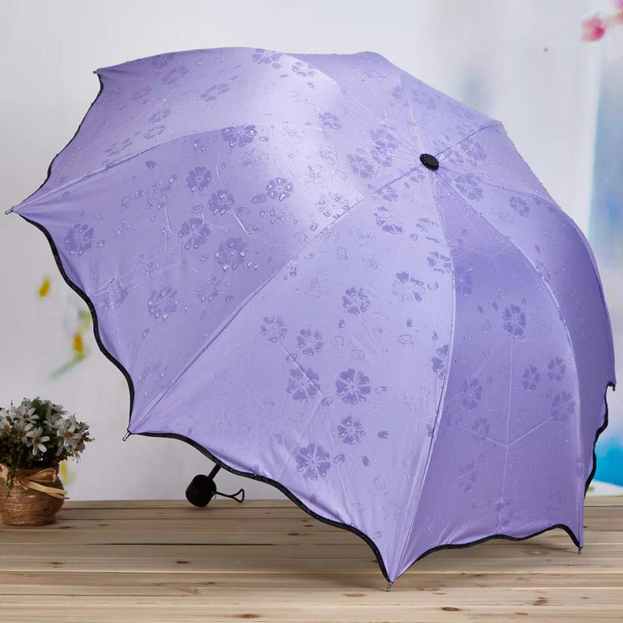Magischer Klappregenschirm mit Regenwassermuster und UV-Schutz für Outdoor und Sport in Rot und Lila - Bild 2