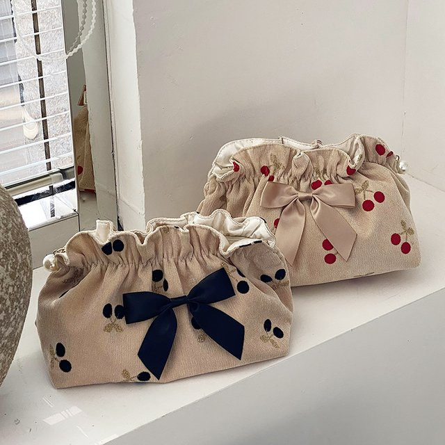 Weiche Cord-Make-up-Tasche mit Schleife als Baby-Windel-Organizer und Damen-Clutch in Schwarz oder Beige - Bild 1