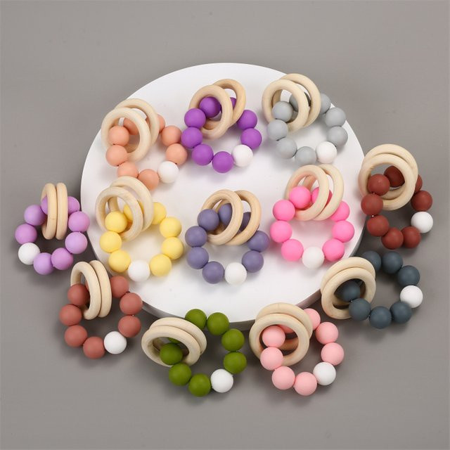 Holzspielzeug Baby-Armbänder, Beißring, Silikonperlen, Holzring, Rasseln - Bild 1