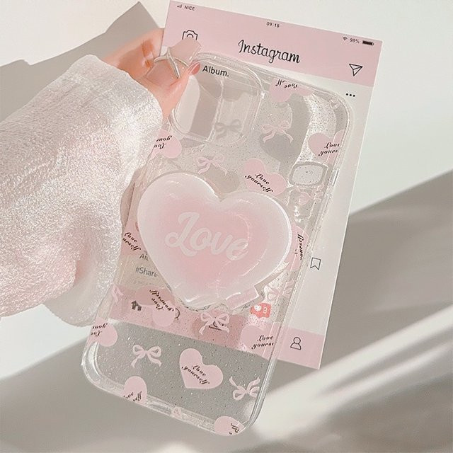 MUQGEW Handyhülle für iPhone mit Herz-Halter und Schleife in Rosa Transparent, Stoßfeste Weiche Hülle mit Glitzer-Design - Bild 1