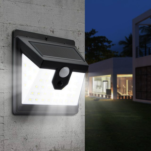Wasserdichte Solar-LED-Wandleuchte mit Bewegungsmelder für den Außenbereich in Schwarz und Weiß - Bild 1