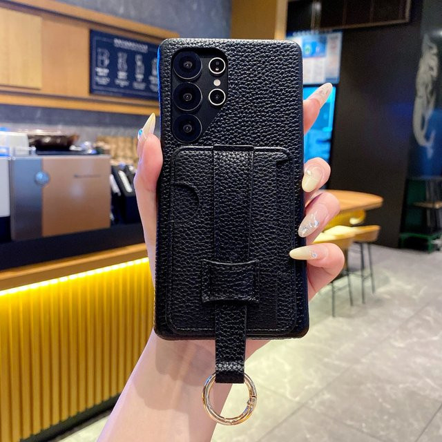 Samsung Handyhülle aus PU Leder mit Litschi-Muster und Kartenhalter sowie Handgelenkstrap in Schwarz für Galaxy S25U S20U S22 A15 A56 A06 - Bild 1