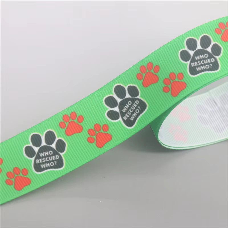 DHK Ripsband mit Hund und Katze Pfoten Motiv Who Rescued Who für DIY Nähen und Handwerk, 50 Yards - Bild 2